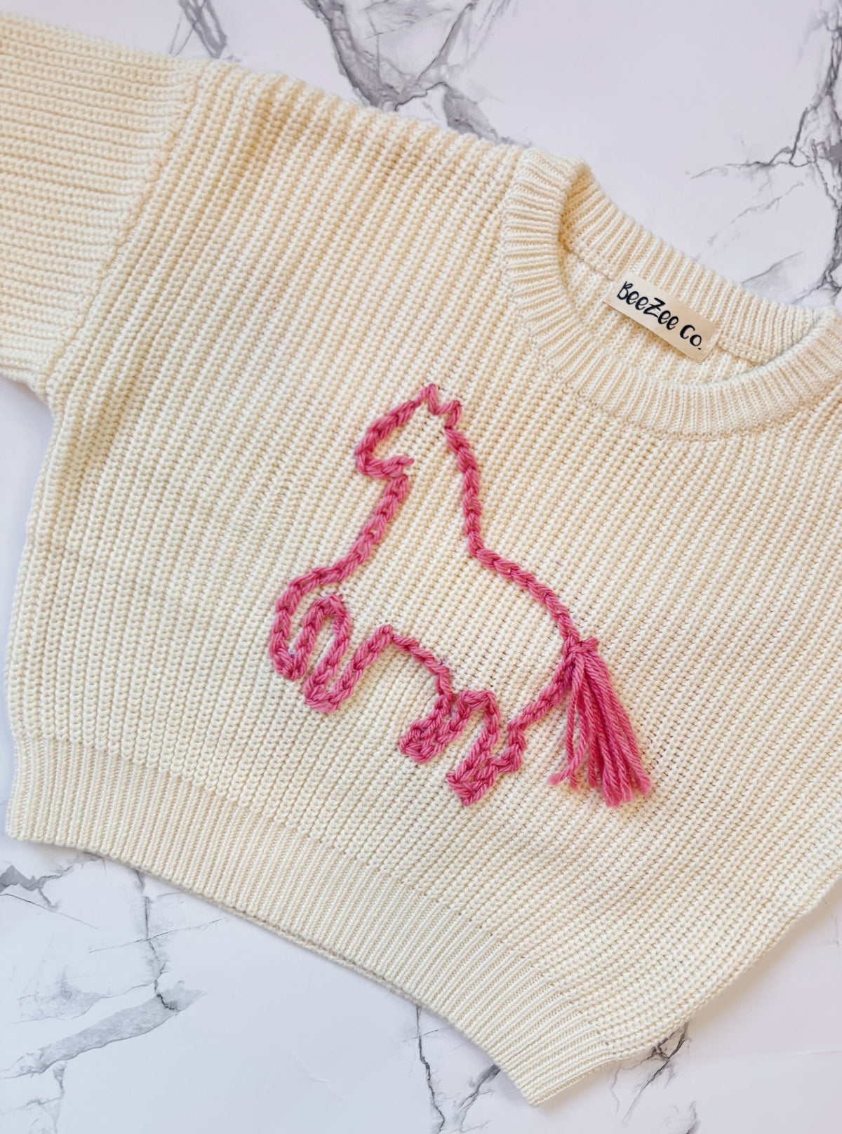 Design your own hand-embroidered toddler sweater by BeeZee